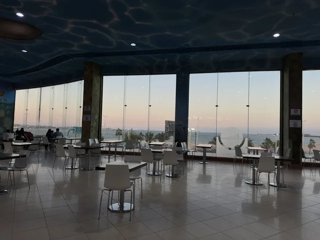 Places to relax in Marina Mall in Dammam City, Eastern Province, Saudi Arabia, a shopping and entertainment center overlooking the waterfront, with diverse shops and brands, restaurants and cafes with sea views, recreational and service facilities, a family destination that combines shopping and entertainment.
