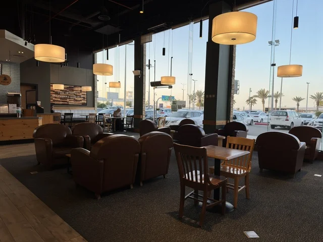 Seating for relaxation at one of the cafes in Marina Mall in Dammam, Eastern Province, Saudi Arabia, a shopping and entertainment center overlooking the waterfront, with diverse shops and brands, restaurants and cafes with sea views, recreational and service facilities, a family destination that combines shopping and entertainment.