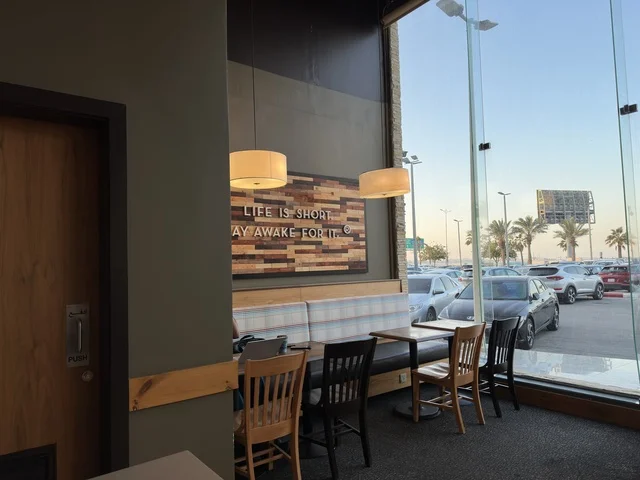 Seating for relaxation at one of the cafes in Marina Mall in Dammam, Eastern Province, Saudi Arabia, a shopping and entertainment center overlooking the waterfront, with diverse shops and brands, restaurants and cafes with sea views, recreational and service facilities, a family destination that combines shopping and entertainment.