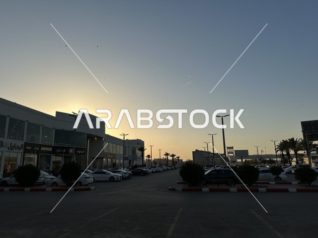 Parking in the outdoor parking lot in front of Marina Mall in Dammam, Eastern Province, Saudi Arabia, a shopping and entertainment center overlooking the waterfront, with various stores and brands, restaurants and cafes with sea views, recreational and service facilities, a family destination that combines shopping and entertainment.