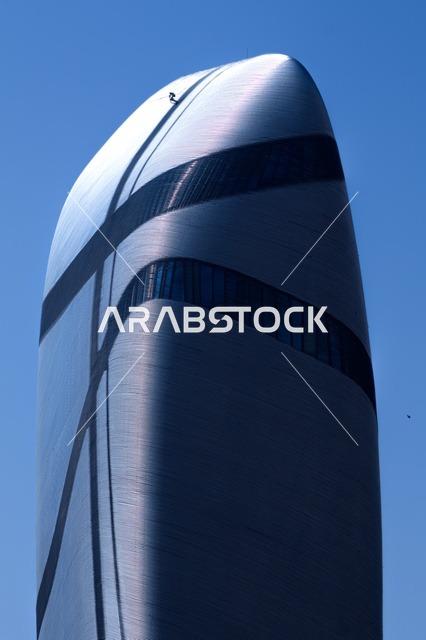 The King Abdulaziz Center for World Culture in Dhahran, the Ithra Cultural Center, modern offices and museums, a lighthouse and famous tourist attractions, distinguished architectural engineering art in the modern style in the Kingdom of Saudi Arabia, the view of the blue sky.