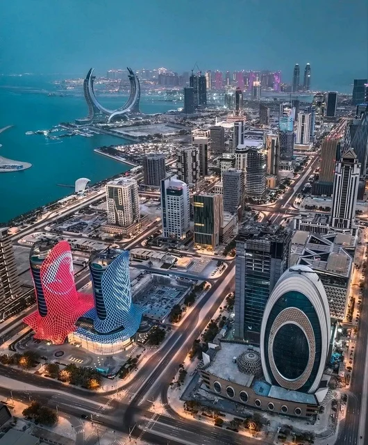 Aerial drone photography of the Qatari city of Lusail, the architectural engineering art of the buildings and skyscrapers in the city of Doha, the waterfront in the State of Qatar during the day, coastal tourist attractions.