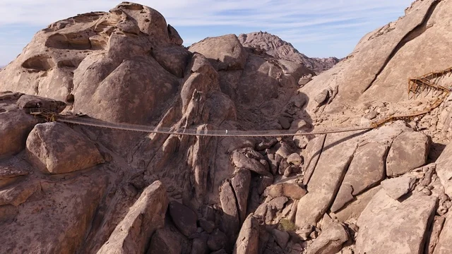 Desert Rock in Saudi Arabia is a luxurious mountain resort integrated with the rocky nature, featuring innovative architectural design carved into the mountains. It offers a unique tourism experience that combines luxury and sustainability, with stunning desert views, making it a global tourist destination.