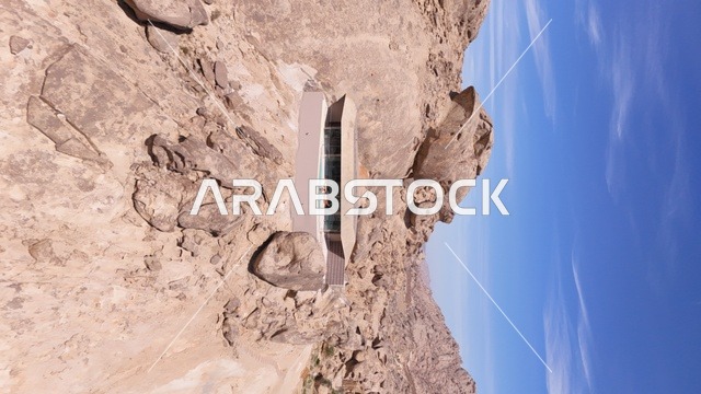 A mountain resort integrated with the rocky nature, Desert Rock in the Kingdom of Saudi Arabia, features an innovative architectural design carved into the mountains, offering a unique tourism experience that combines luxury and sustainability, with stunning desert views, making it a global tourist destination.