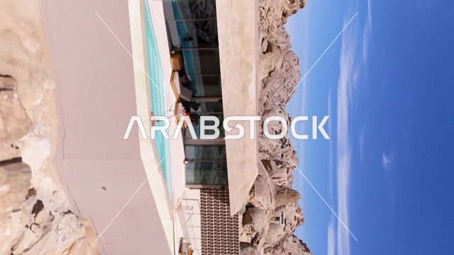 A mountain resort integrated with the rocky nature, Desert Rock in the Kingdom of Saudi Arabia, features an innovative architectural design carved into the mountains, offering a unique tourism experience that combines luxury and sustainability, with stunning desert views, making it a global tourist destination.