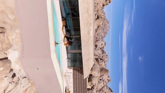 A mountain resort integrated with the rocky nature, Desert Rock in the Kingdom of Saudi Arabia, features an innovative architectural design carved into the mountains, offering a unique tourism experience that combines luxury and sustainability, with stunning desert views, making it a global tourist destination.