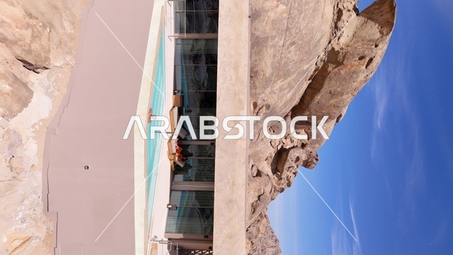 A mountain resort integrated with the rocky nature, Desert Rock in the Kingdom of Saudi Arabia, features an innovative architectural design carved into the mountains, offering a unique tourism experience that combines luxury and sustainability, with stunning desert views, making it a global tourist destination.