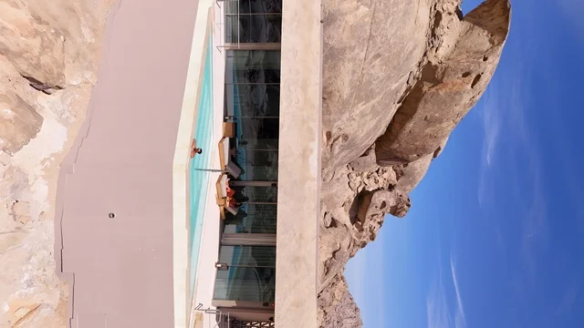 A mountain resort integrated with the rocky nature, Desert Rock in the Kingdom of Saudi Arabia, features an innovative architectural design carved into the mountains, offering a unique tourism experience that combines luxury and sustainability, with stunning desert views, making it a global tourist destination.