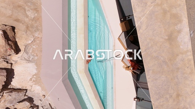 A mountain resort integrated with the rocky nature, Desert Rock in the Kingdom of Saudi Arabia, features an innovative architectural design carved into the mountains, offering a unique tourism experience that combines luxury and sustainability, with stunning desert views, making it a global tourist destination.