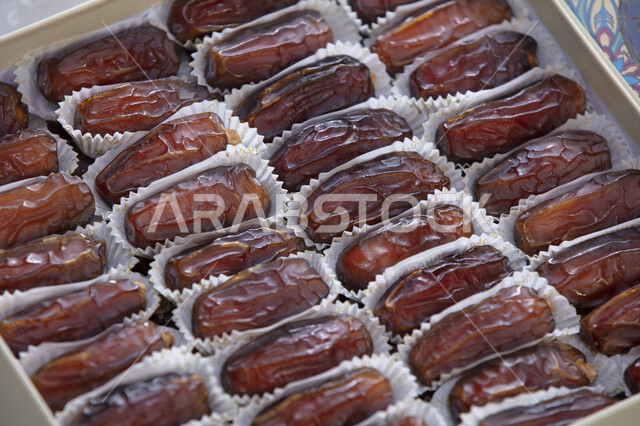A group of date kernels filled with high nutritional values, summer fruits, fruits of palm trees, a healthy food item