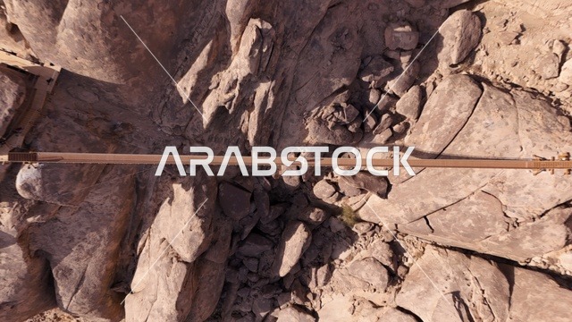 A global tourist destination, a mountain resort integrated with the rocky nature, Desert Rock in the Kingdom of Saudi Arabia, features innovative architectural design carved into the mountains, offering a unique tourism experience that combines luxury and sustainability, with stunning desert views.