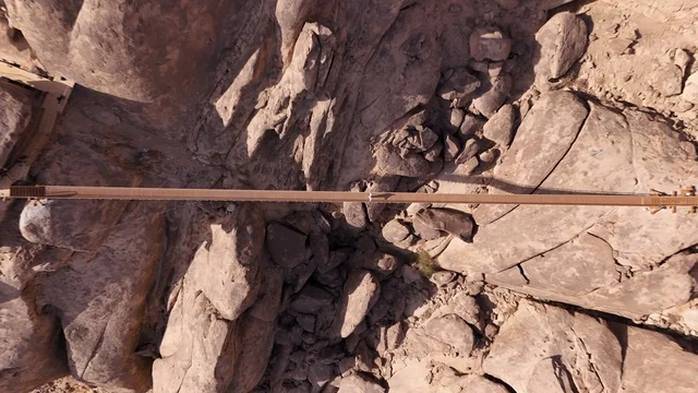 A global tourist destination, a mountain resort integrated with the rocky nature, Desert Rock in the Kingdom of Saudi Arabia, features innovative architectural design carved into the mountains, offering a unique tourism experience that combines luxury and sustainability, with stunning desert views.