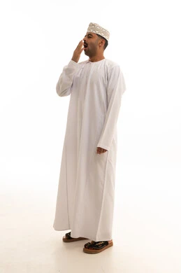Omani Man Yawning in Traditional Dress on White Background