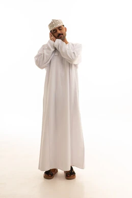 Omani Man in Traditional Dishdasha Sleeping Pose