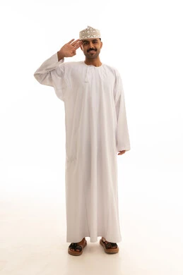 Omani Man in Traditional Dishdasha Performing Salute
