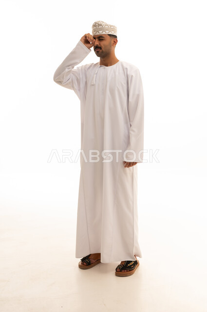 Omani Man in Traditional Dishdasha on White Background