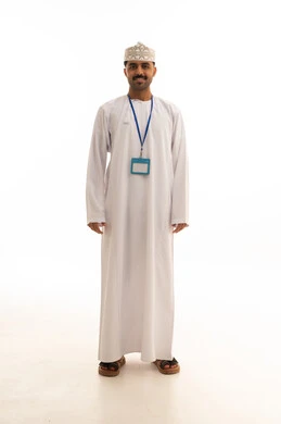Omani Man in Traditional White Dishdasha and Kumma