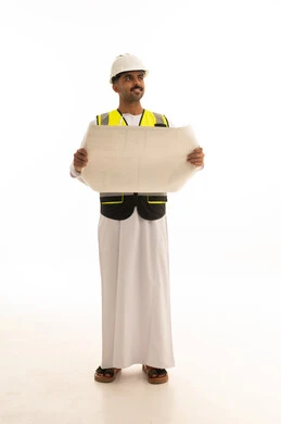 مهندس عماني يحمل مخططاً معمارياً على خلفية بيضاء