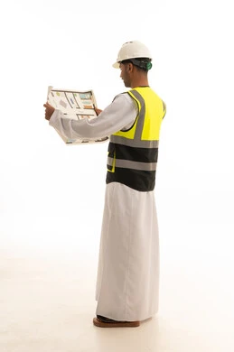 Omani Engineer with Blueprints in White Studio