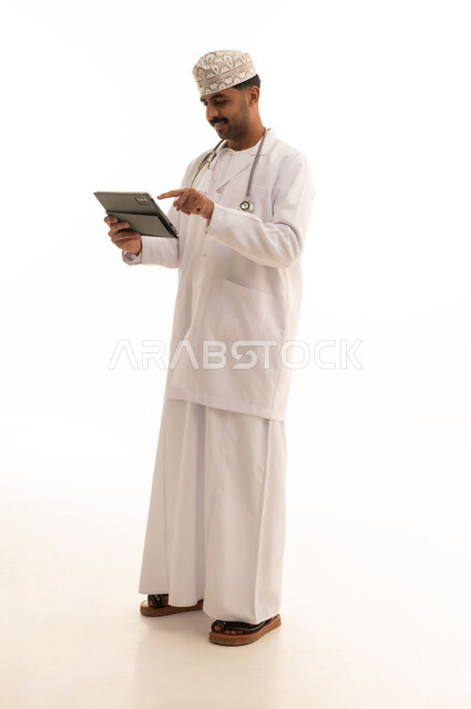 Omani Doctor with Digital Tablet on White Background