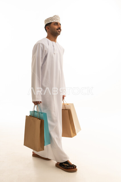 Omani Man Carrying Shopping Bags White Background