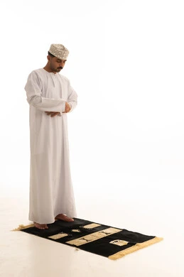 Omani Man Praying on Mat White Background