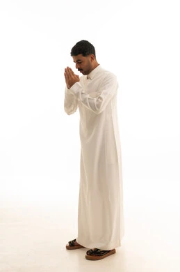 Saudi Man in White Thobe Making Prayer Gesture