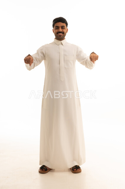 Saudi Man in Traditional Thobe Pointing Downward