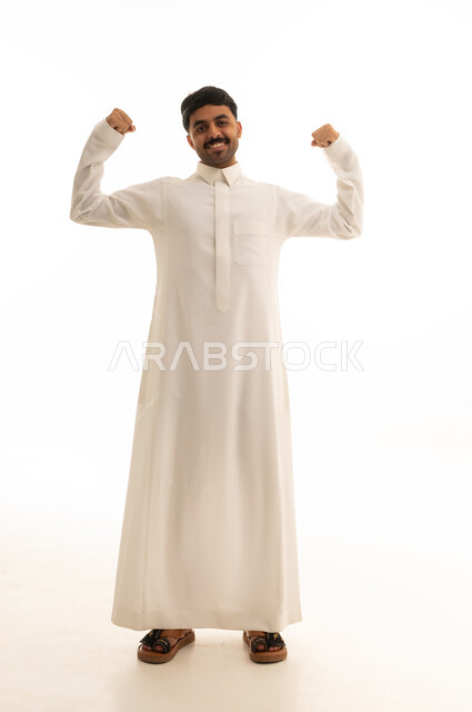 Saudi Man in White Thobe Flexing Muscles