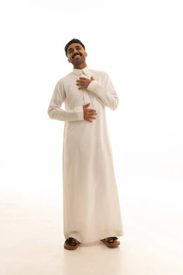 Smiling Saudi Man in White Thobe Studio Portrait