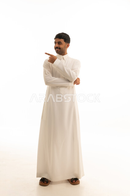 Saudi Man in Thobe Pointing on White Background