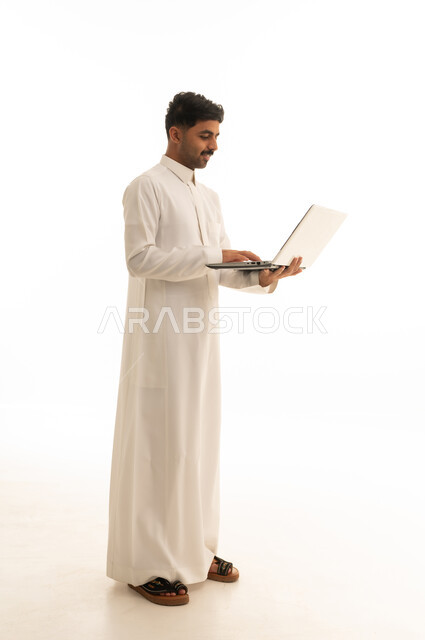 Saudi Man in Thobe Using Laptop on White Background