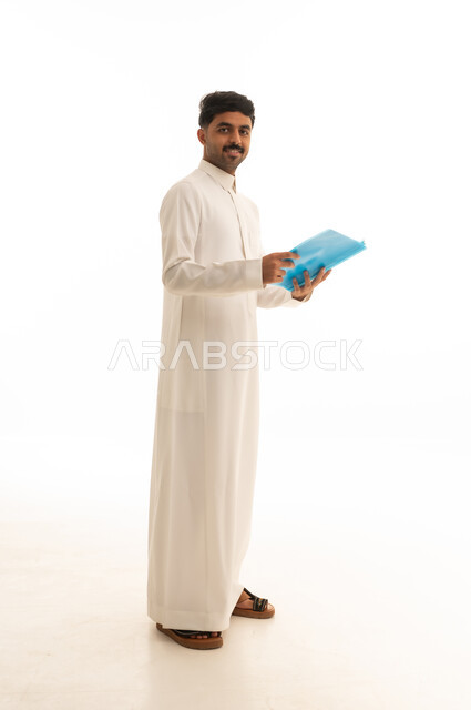 Saudi Man in White Thobe Holding Blue Folder