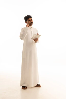 Saudi Man in Thobe Thinking with Notepad on White Background