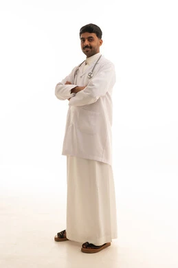 Saudi Male Doctor in White Lab Coat on White Background