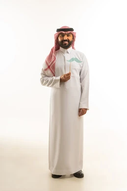 Saudi Man in Traditional Thobe Holding Mustache Prop