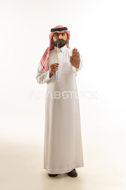 Saudi Man Making Stop Gesture with Mustache Prop