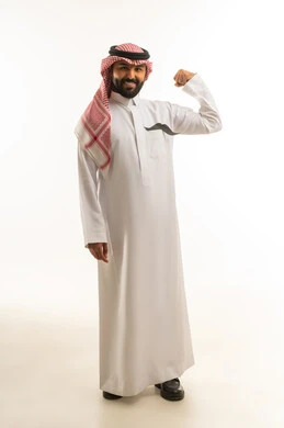 Saudi Man in Traditional Dress Flexing Muscle