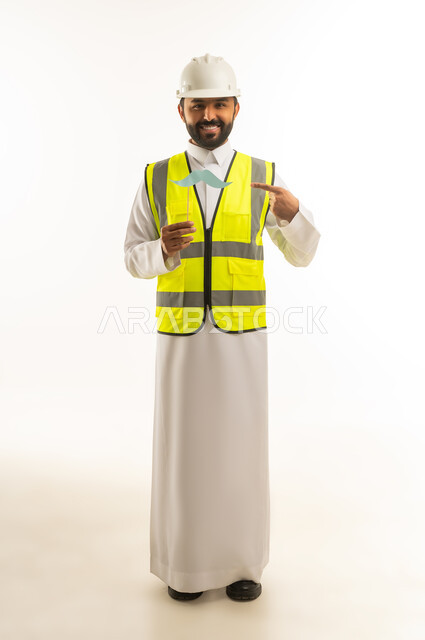 Saudi Engineer in White Thobe Holding Mustache Prop