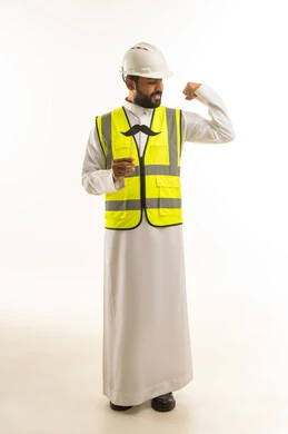 Saudi Engineer in Thobe and Safety Vest Flexing