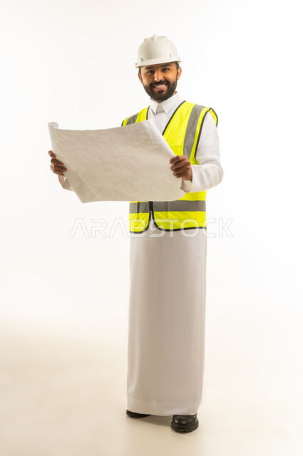 Saudi Male Engineer Holding Architectural Blueprints