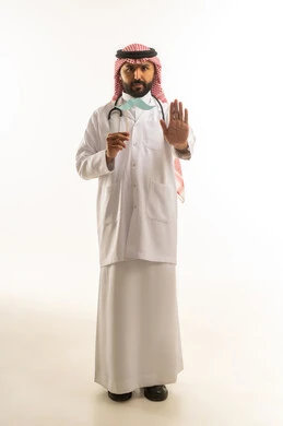 Saudi Doctor Holding Mustache Prop with Stop Gesture