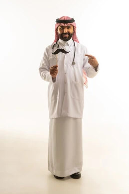 Saudi Doctor with Mustache Prop for Movember