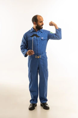 Saudi Maintenance Worker Flexing Muscle in Blue Jumpsuit