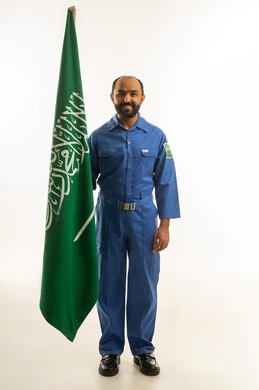 Saudi Male Worker in Blue Uniform with Saudi Flag