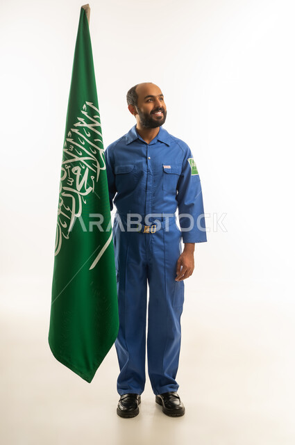 Saudi Technician in Blue Uniform with National Flag