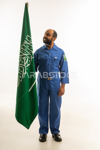 Saudi Worker in Blue Uniform with National Flag