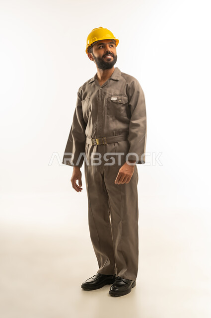 Saudi Male Worker in Grey Uniform and Safety Helmet