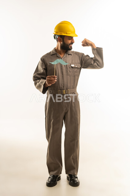 Saudi Construction Worker Flexing in Hard Hat