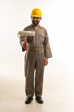 Indian Construction Worker with Paint Roller in Studio